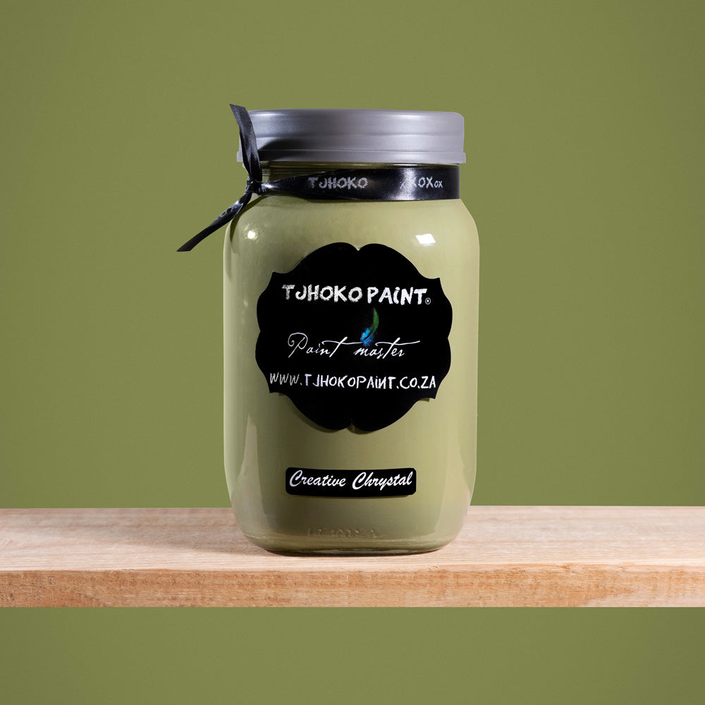 Creative Chrystal is a dark yet muted shade of olive green, reminiscent of sun-dappled leaves.
