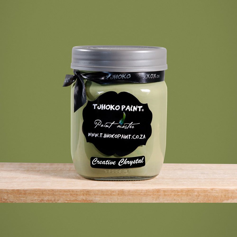 Creative Chrystal is a dark yet muted shade of olive green, reminiscent of sun-dappled leaves.