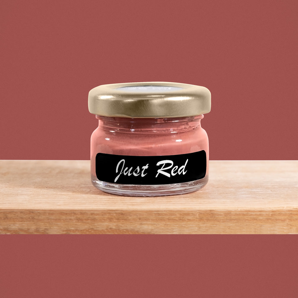 Just Red is a muted, shade of a brown--red with a tinge of muted pink.