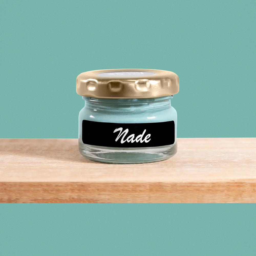 Nade is a soothing shade of aqua green, reminiscent of calm ocean waters.
