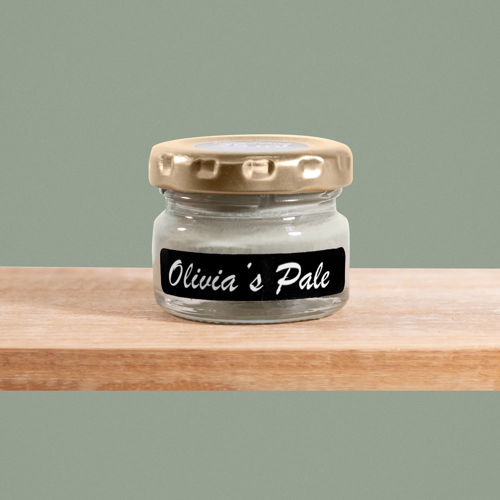 Olivia's Pale is a soft, muted shade of green-gray olive tones reminiscent of misty mornings in the countryside.