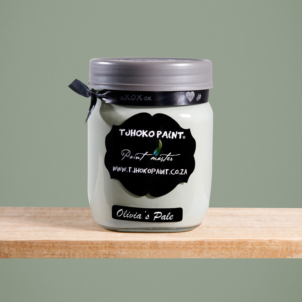 Olivia's Pale is a soft, muted shade of green-gray olive tones reminiscent of misty mornings in the countryside.