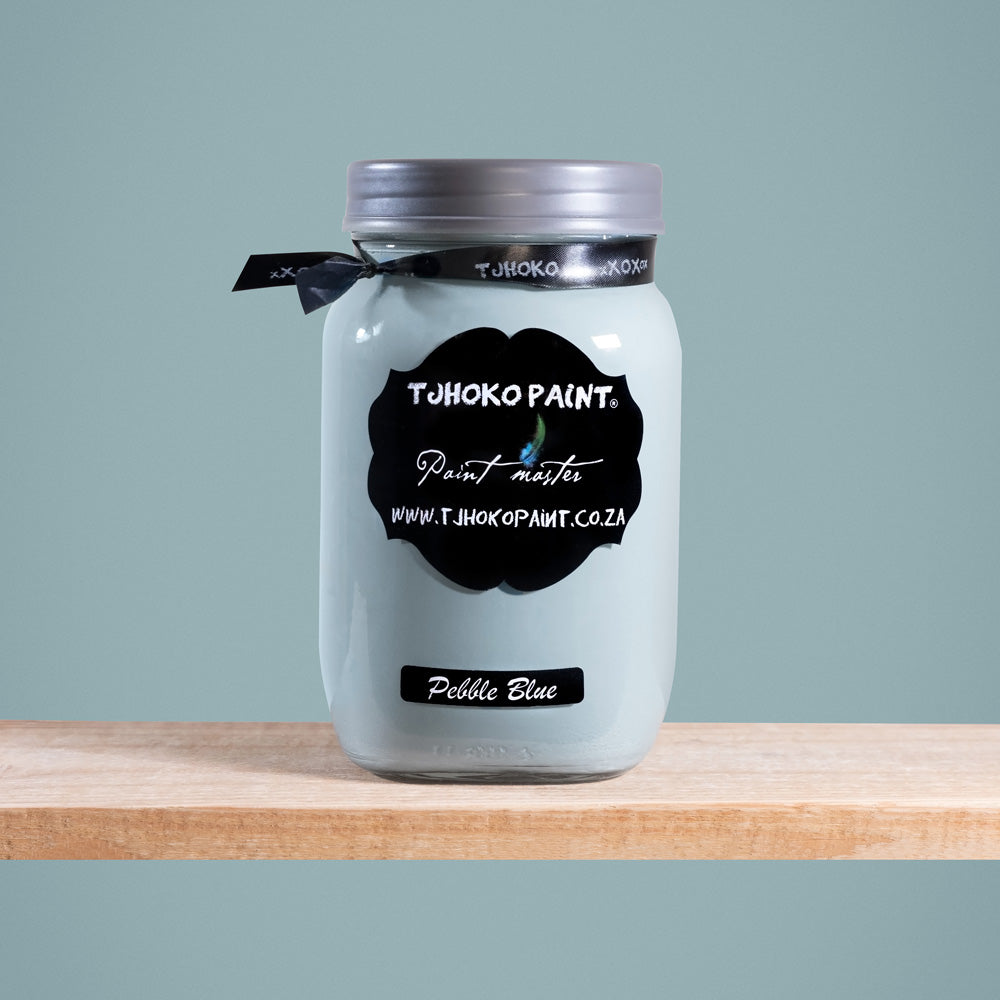 Pebble Blue is a tranquil shade of muted blue-gray, reminiscent of smooth pebbles washed ashore by gentle waves.
