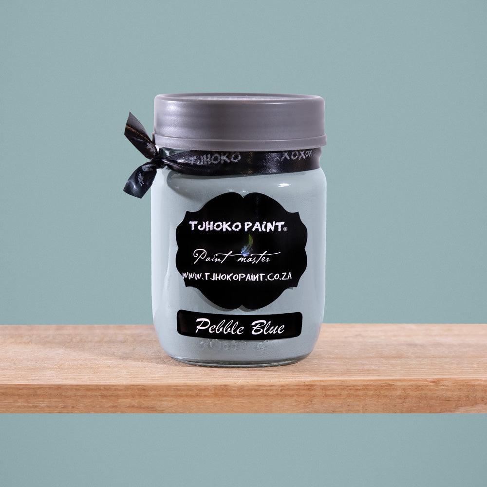 Pebble Blue is a tranquil shade of muted blue-gray, reminiscent of smooth pebbles washed ashore by gentle waves.