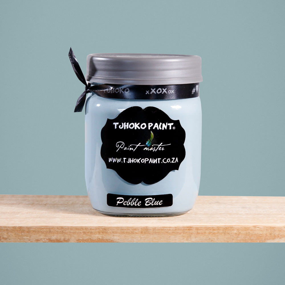 Pebble Blue is a tranquil shade of muted blue-gray, reminiscent of smooth pebbles washed ashore by gentle waves.