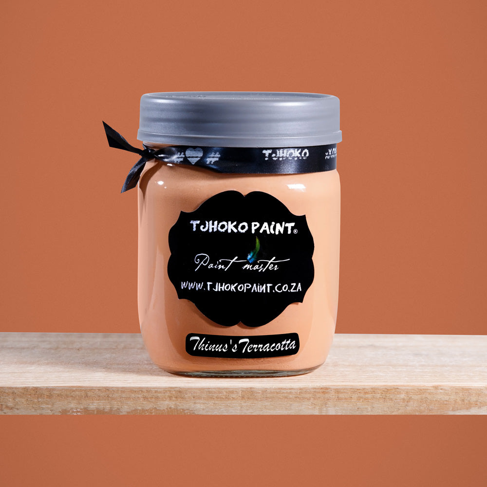 Thinus's Terracotta is a rich, earthy shade of orange reminiscent of sun-baked clay.