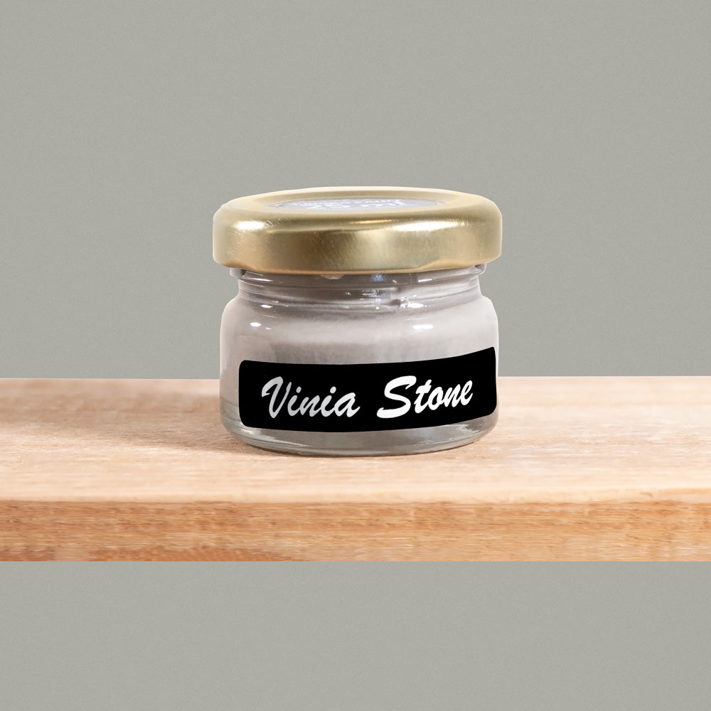 Vinia Stone is a refined shade of taupe with hints of olive undertones. It exudes sophistication and understated luxury, reminiscent of the smooth surface of polished stone.