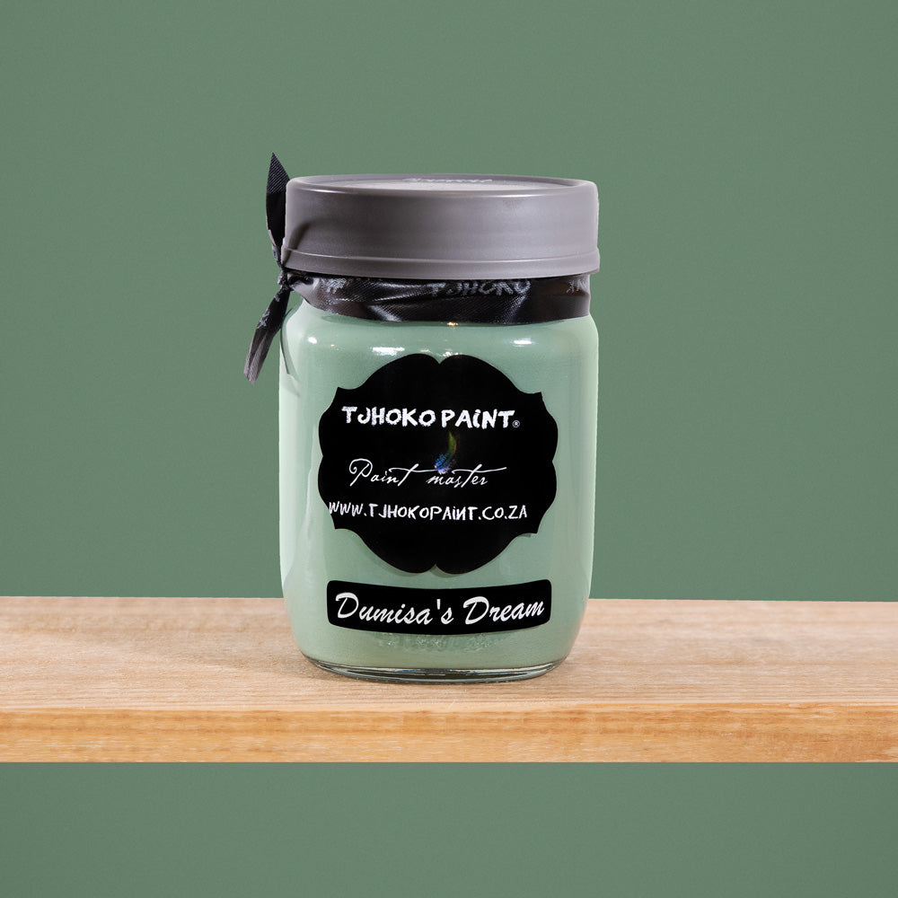 Dumisa's Dream is a serene shade of muted sage green, reminiscent of tranquil forest landscapes.