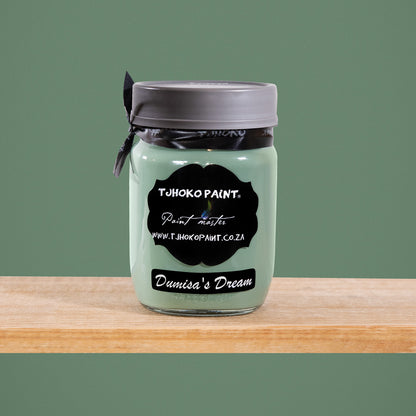Dumisa's Dream is a serene shade of muted sage green, reminiscent of tranquil forest landscapes.