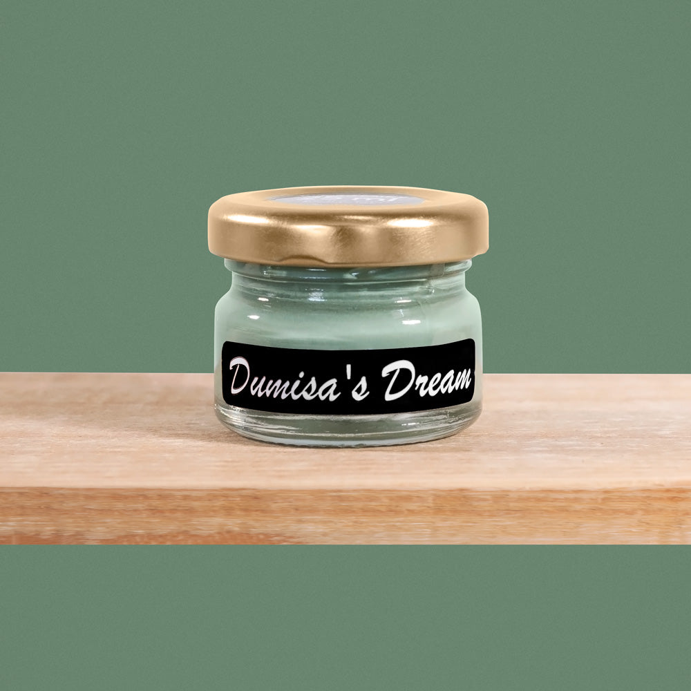 Dumisa's Dream is a serene shade of muted sage green, reminiscent of tranquil forest landscapes.