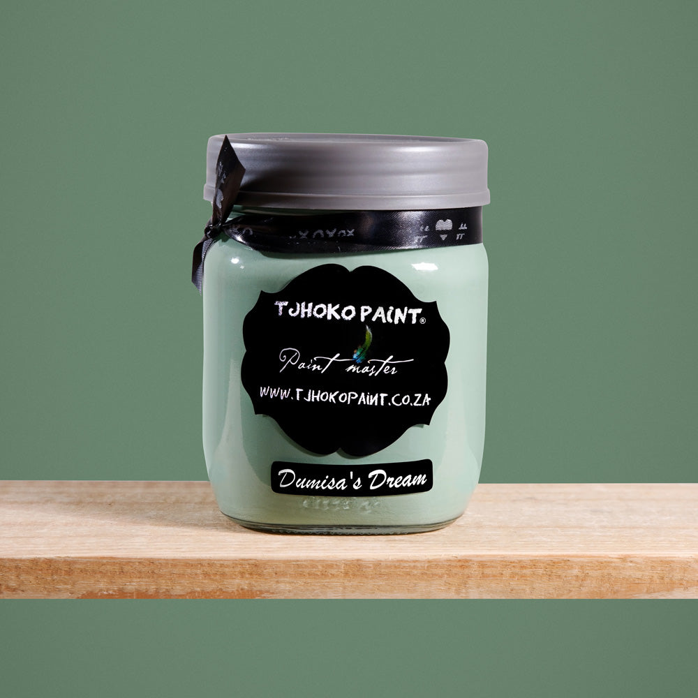 Dumisa's Dream is a serene shade of muted sage green, reminiscent of tranquil forest landscapes.