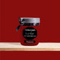 A deep red shade that radiates warmth and timeless elegance